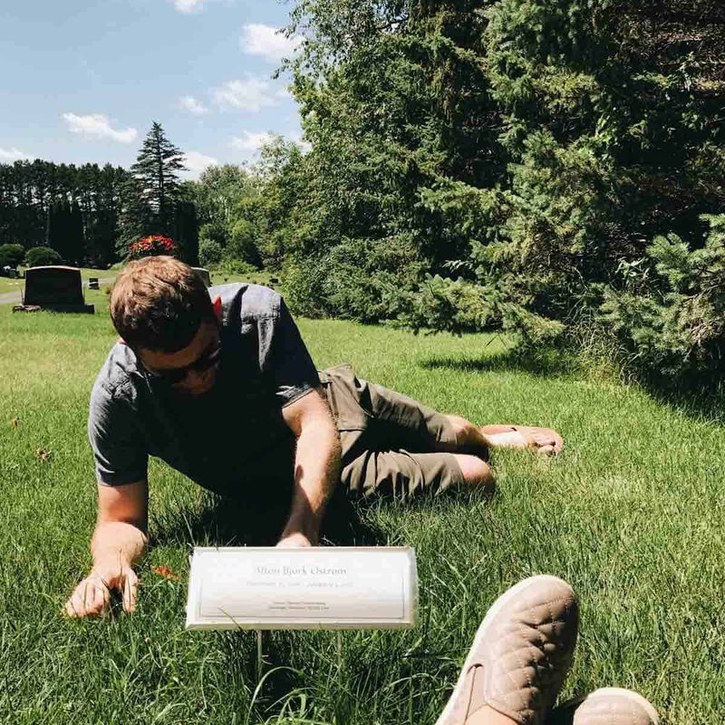 Lindsay and Bjork laying in the grass at the cemetary.