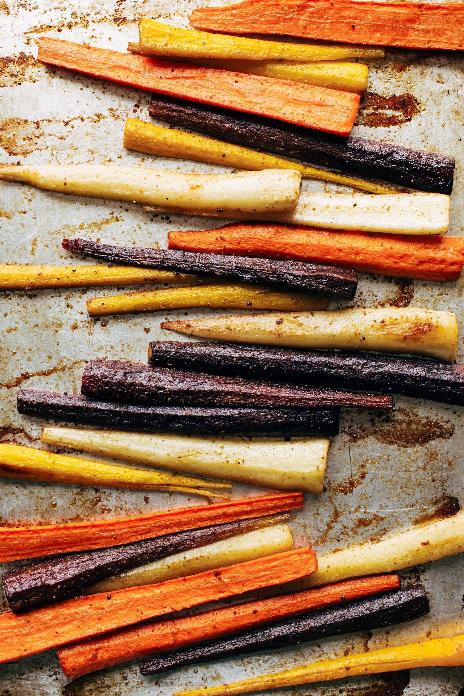 Roasted carrots on a sheet pan.