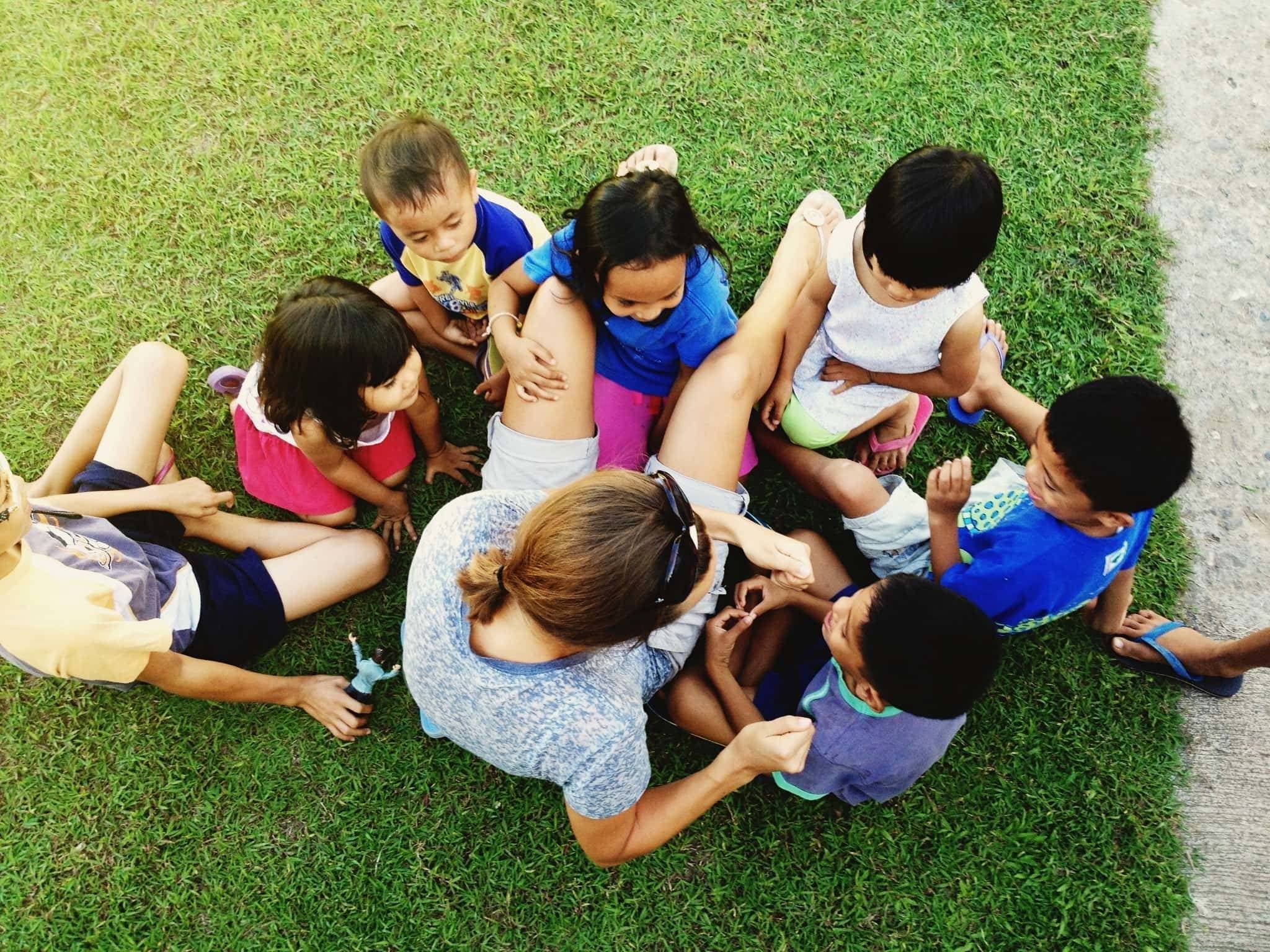 Children around a woman.