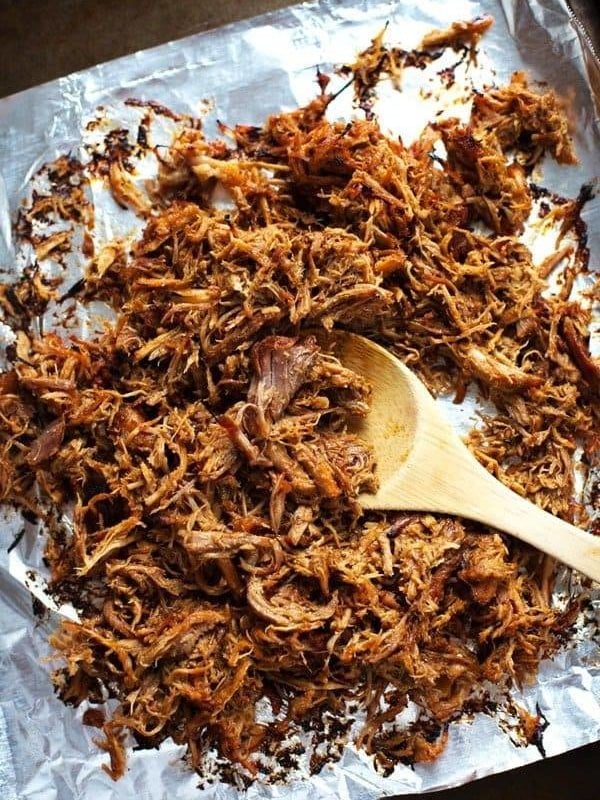 Super Easy Crockpot Shredded Pork - and a trick for getting those deliciously golden crispy bits! | pinchofyum.com