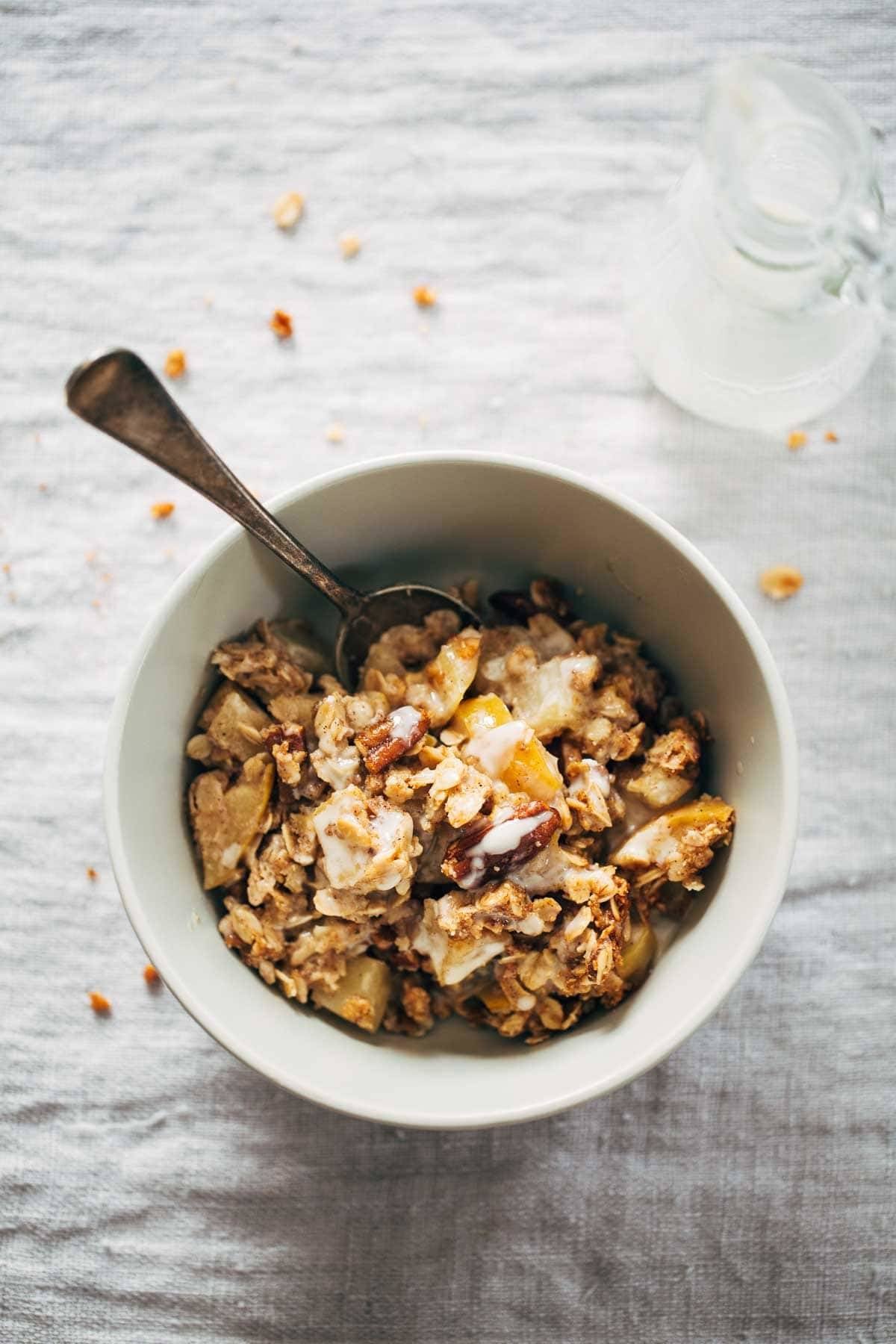 Coconut Oil Apple Crisp in a bowl with a spoon.