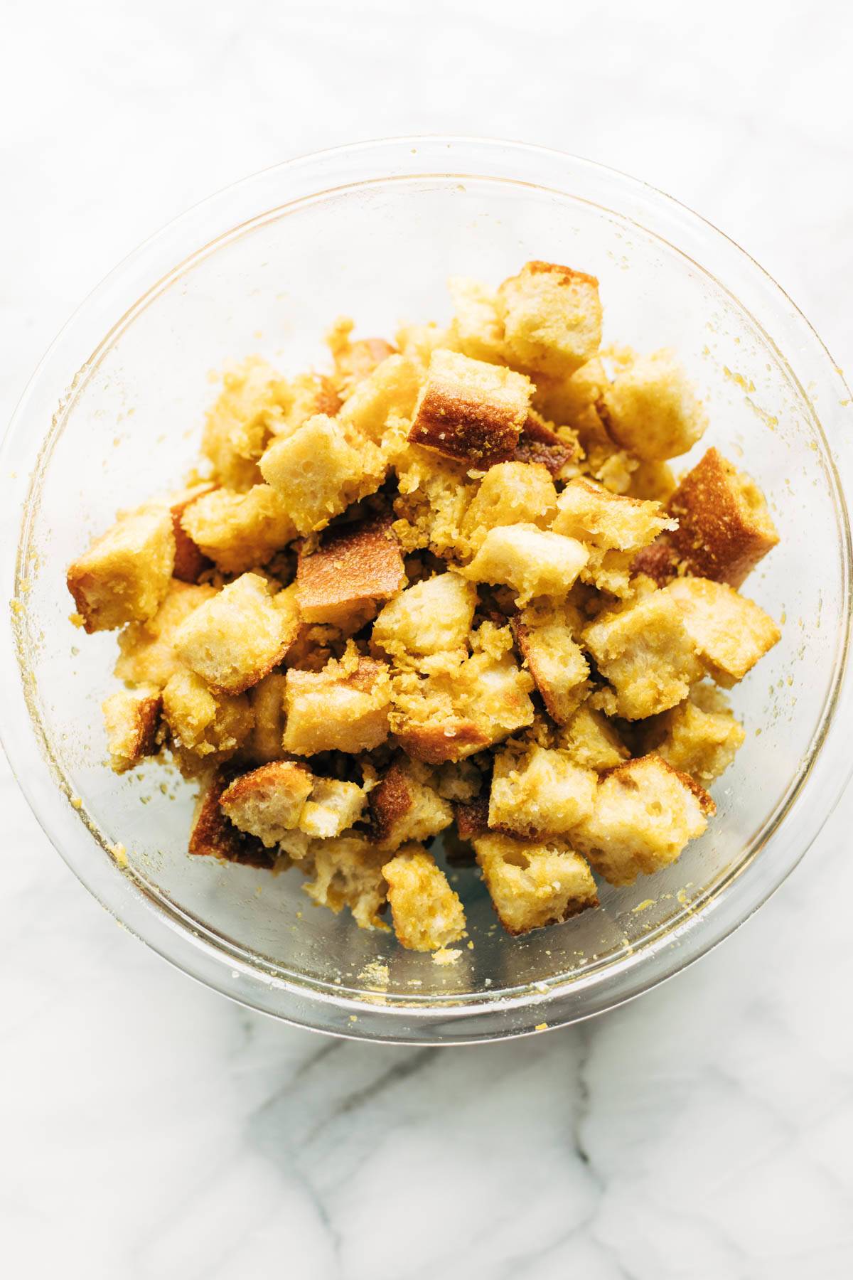 Cheezy Garlic Croutons in a bowl before baking.