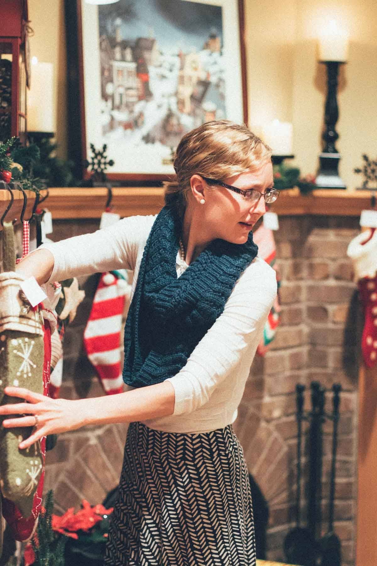 Woman reaching into a stocking.