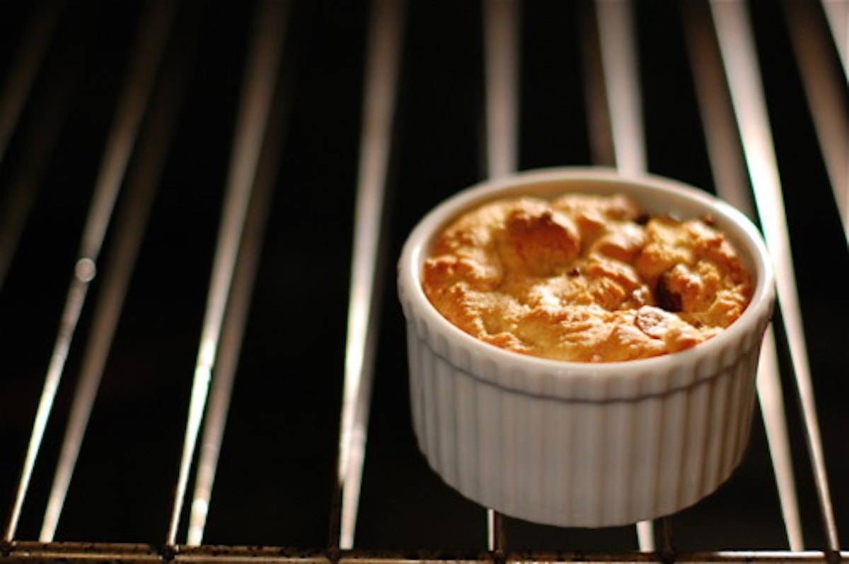 Deep Dish Chocolate Chip Cookie baking on an oven rack.
