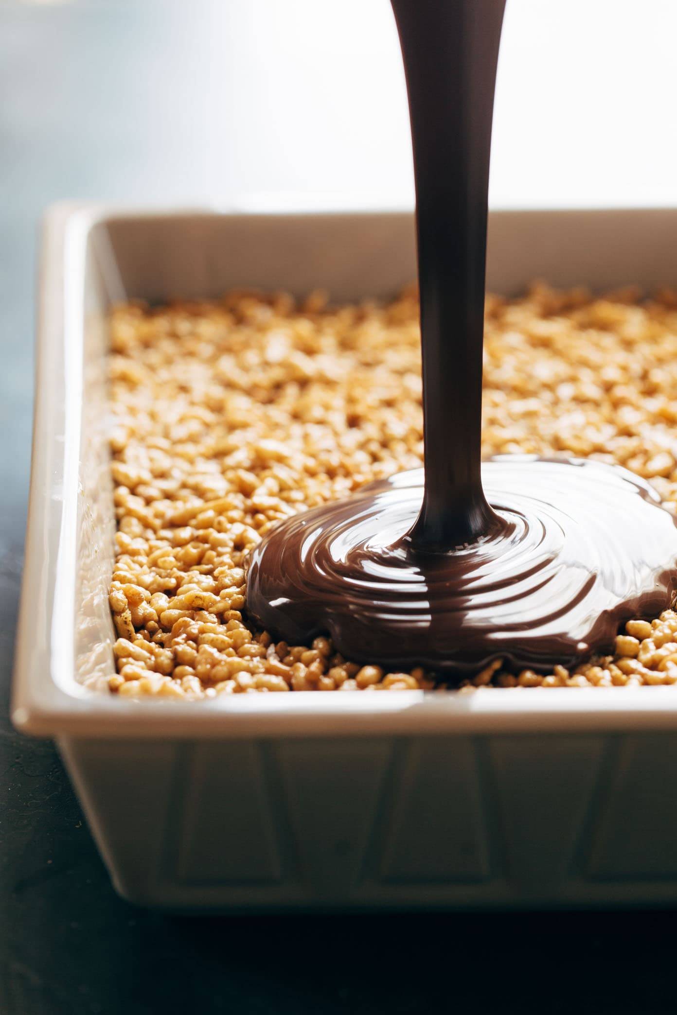Peanut butter rice krispie bars drizzled with chocolate.